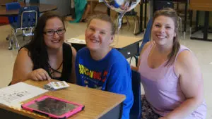 teachers helping a child with special education transition activity - Watson Institute