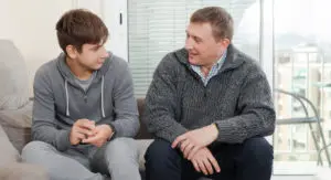 teacher with student teaching sexual education for children with disabilities - Watson Institute