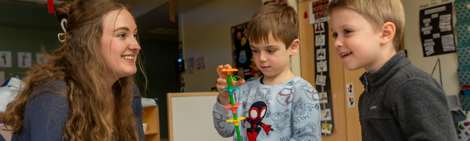 special education teacher pictured with two preschool students in an inclusive classroom - Watson Institute