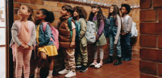 students waiting patiently while transitioning between activities at school - Watson Institute