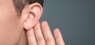 a student's ear represents active listening and the social skills necessary to show peers that they are listening during conversations - Watson Institute