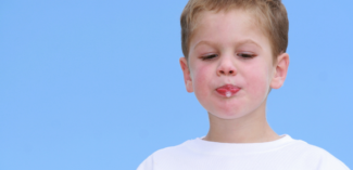 young child drooling can be helped with strategies to address purposeful spitting - Watson Institute