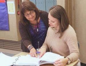 Educational Consultant meets with a special education teacher to offer insights.