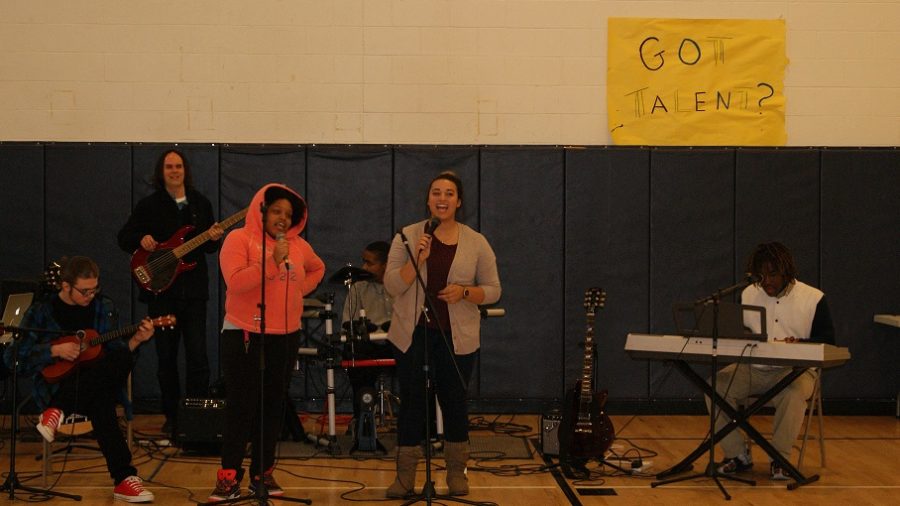 Music Therapist, Jason Rafalak and intern Erika Kuhn perform with Friendship Academy students in Talent Show. 