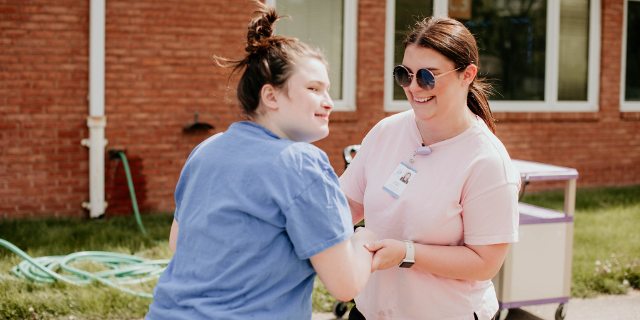 a Watson special education teacher working ESY extended school year over the summer with a student with disabilities.