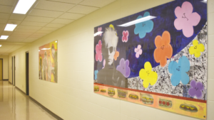 image of a school hallway with student artwork displayed on the walls