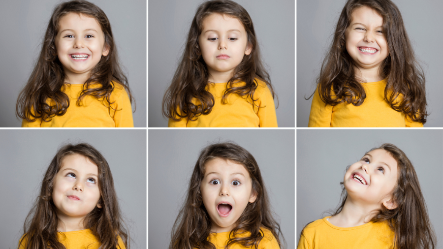 young child making faces to show different emotional expressions - Watson Institute