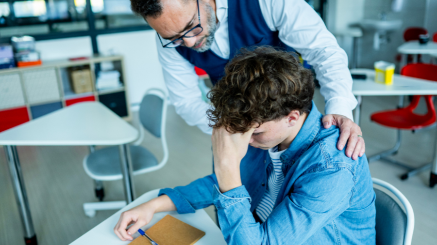 educator attempting to de-escalate a student who is frustrated by using prevention strategies - Watson Institute