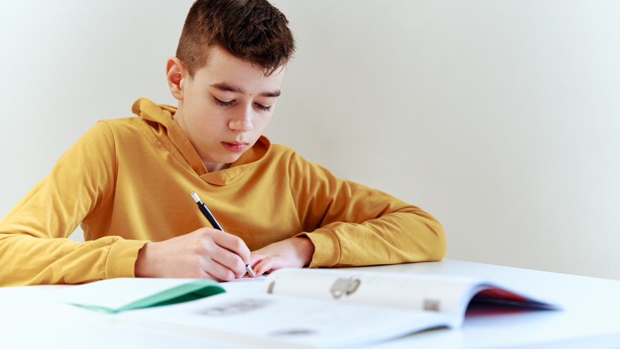 student engaged in on-task behavior completing schoolwork - Watson Institute