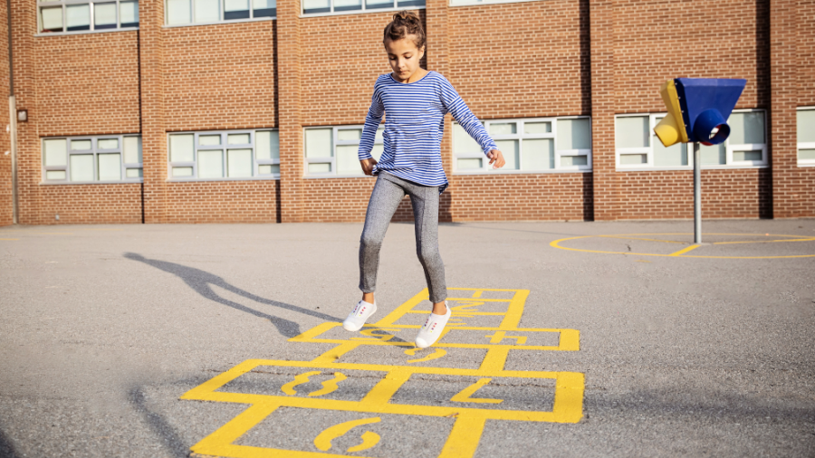 student playing outside during recess - Watson Institute