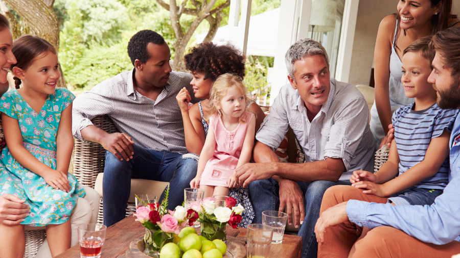 a group of people are gathered together including young children - Watson Institute
