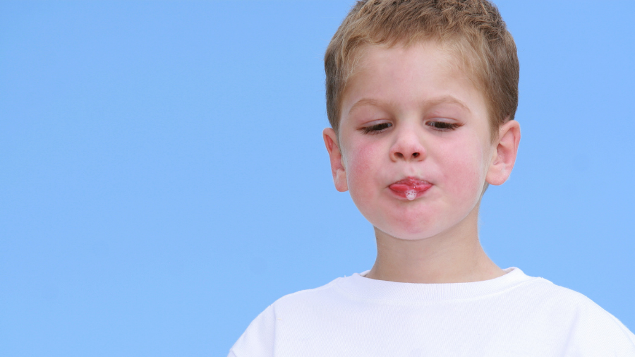 young child drooling can be helped with strategies to address purposeful spitting - Watson Institute